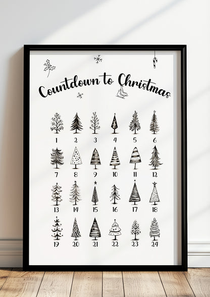 Adventskalender-Poster mit Tannenbaum-Illustrationen im schwarzen Holzrahmen, stehend auf dem Boden
