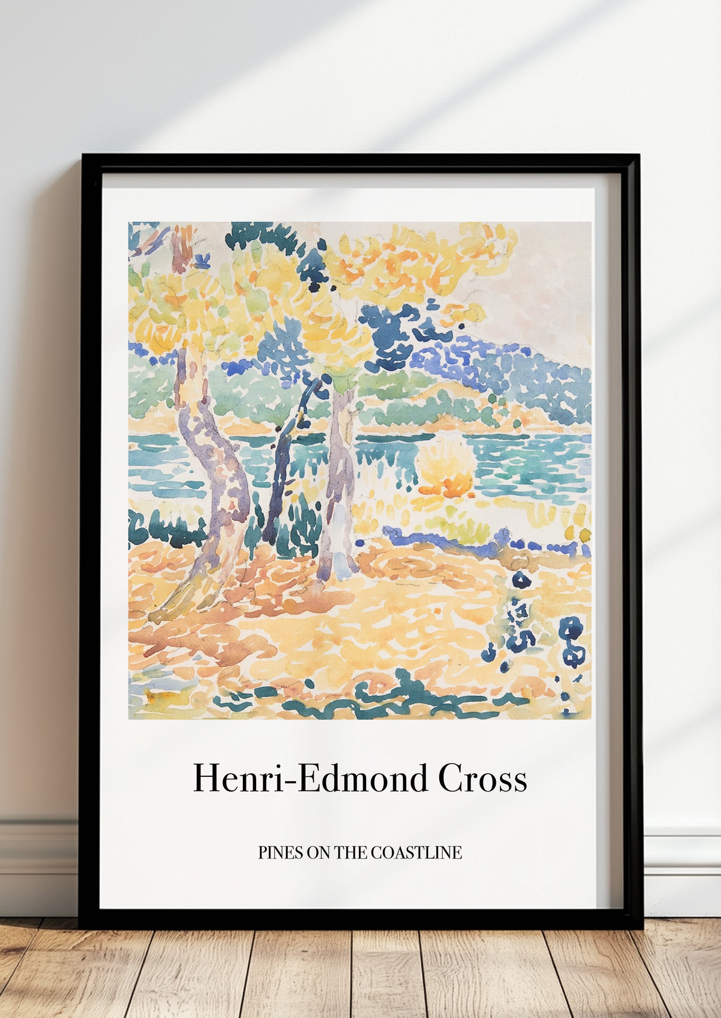 Pines on the Coastline von Henri Edmond Cross als Poster, in schwarzem Rahmen, stehend auf dem Boden, angelehnt an einer Wand