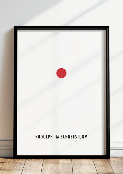 Rudolph im Schneesturm-Poster im schwarzen Holzrahmen steht auf dem Boden