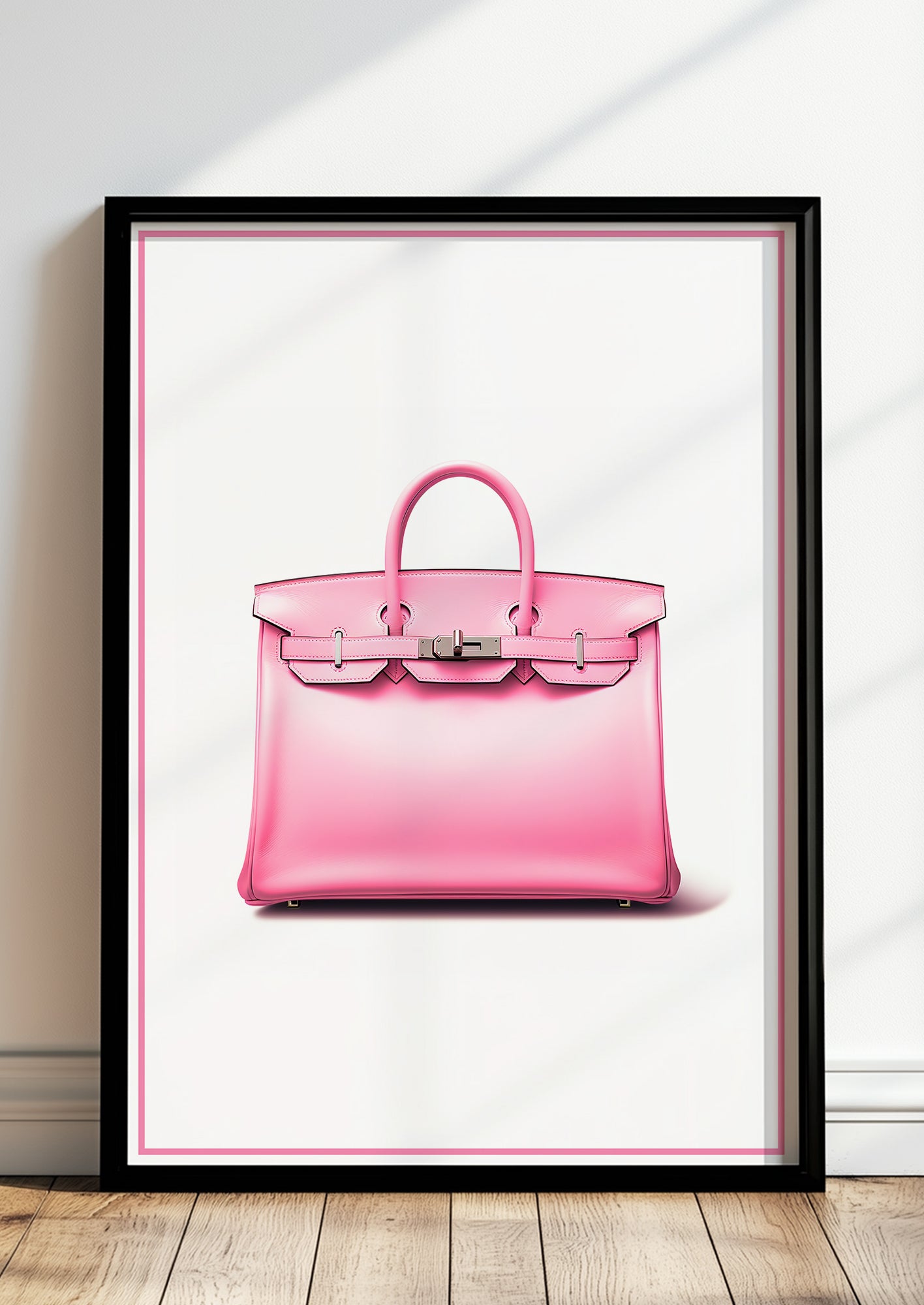 Pinke Designer-Handtasche in schwarzem Holzrahmen steht auf dem Boden