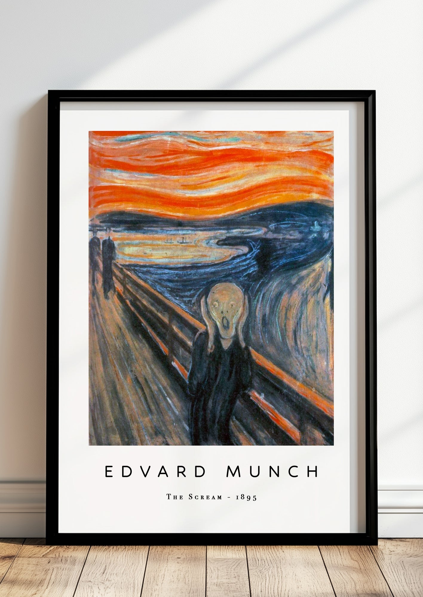 The Scream von Edvard Munch Kunstdruck im schwarzen Rahmen, an Wand gelehnt
