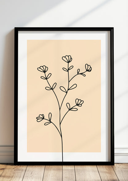 Poster „Line Art Blütenzweig“ in schwarzem Holzrahmen steht auf dem Boden