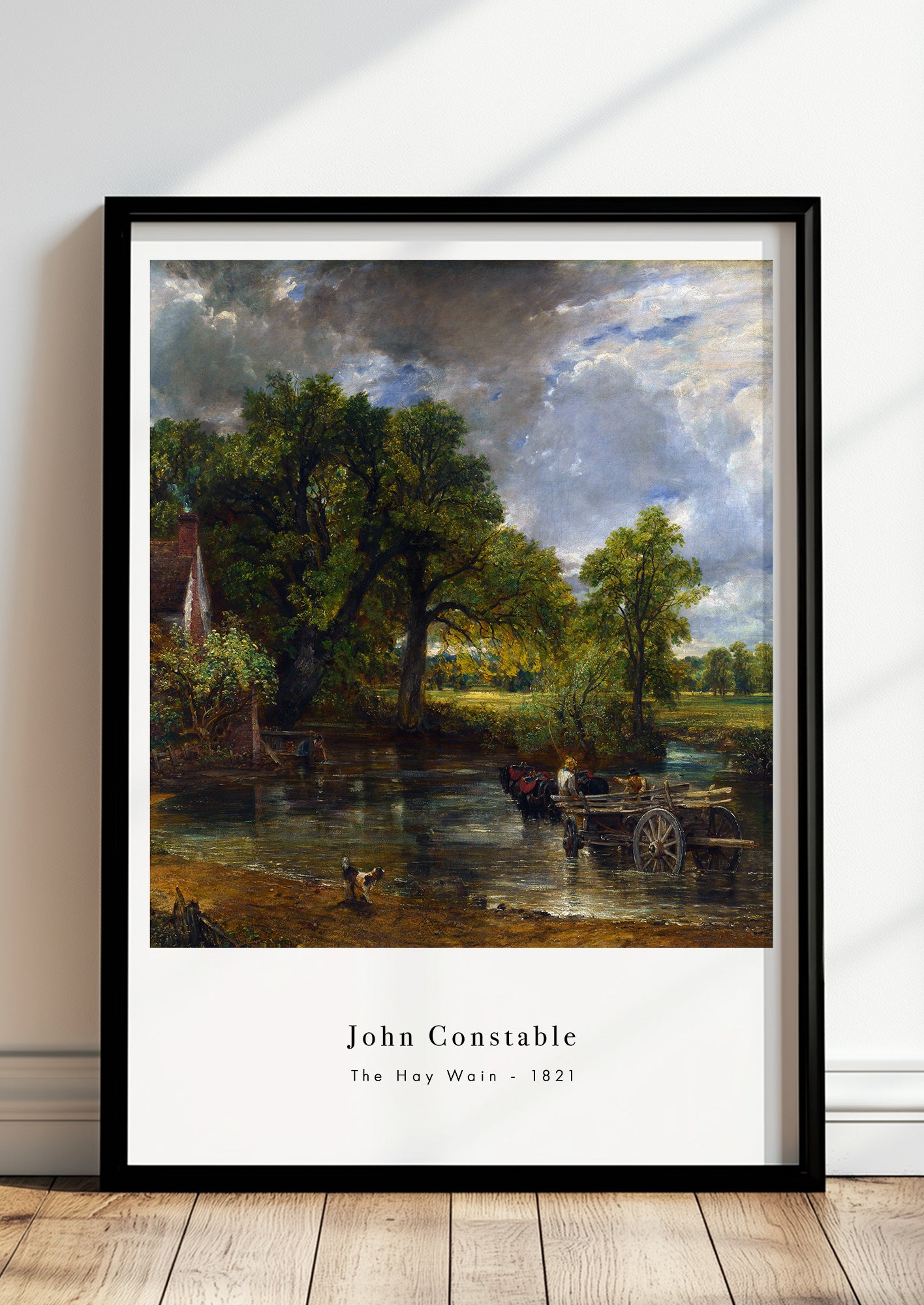 The Hay Wain von John Constable Kunstdruck im schwarzen Rahmen, an Wand gelehnt