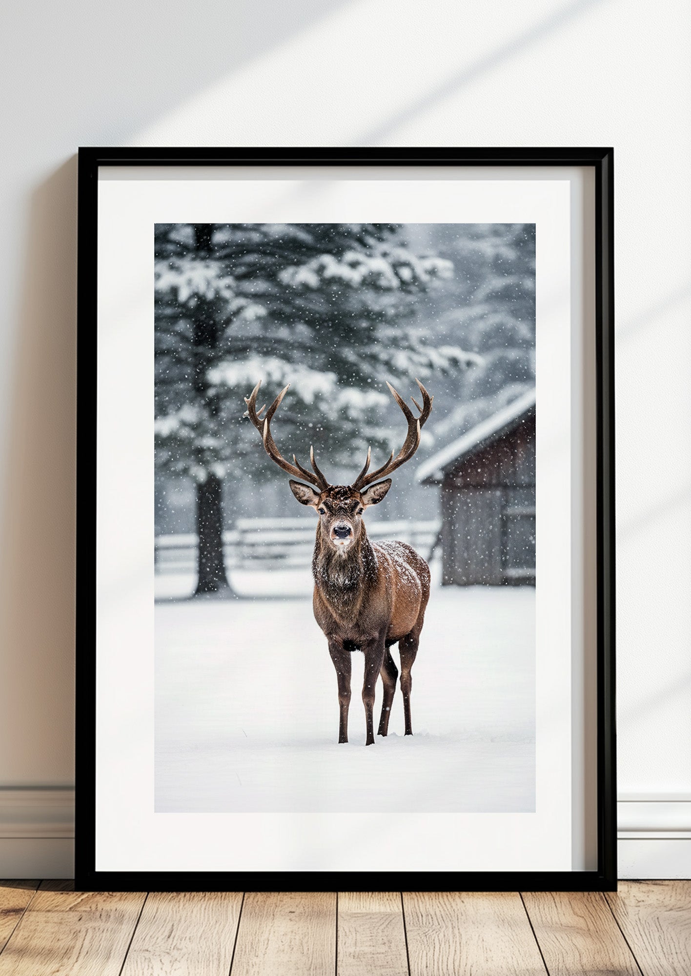 Poster Hirsch im Schnee im schwarzen Rahmen stehend