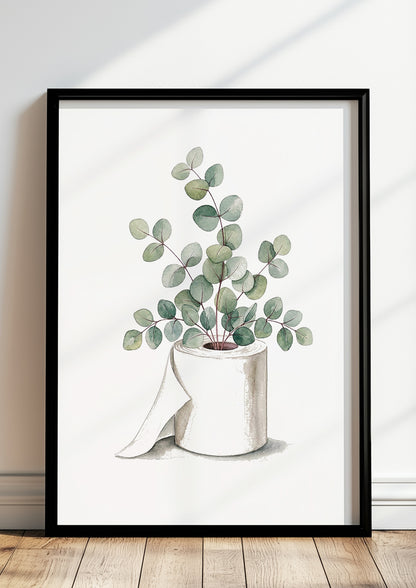Aquarell Poster mit Eukalyptus in einer Klopapierrolle, im schwarzen Rahmen an eine helle Wand gelehnt