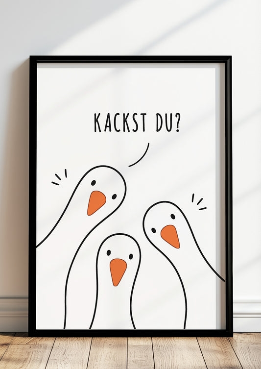 Lustiges Gänse Poster mit dem Spruch Kackst du, im schwarzen Rahmen an eine helle Wand gelehnt