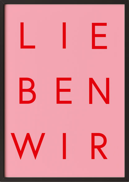Typografieposter „LIEBEN WIR“ in Rot auf Rosa im schwarzen Holzrahmen