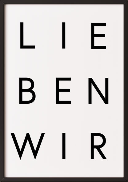 Typografieposter „LIEBEN WIR“ in Schwarz-Weiß im schwarzen Holzrahmen