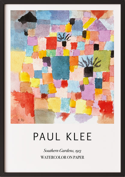 Frau hängt Southern Gardens von Paul Klee als Poster in schwarzem Rahmen an die Wand