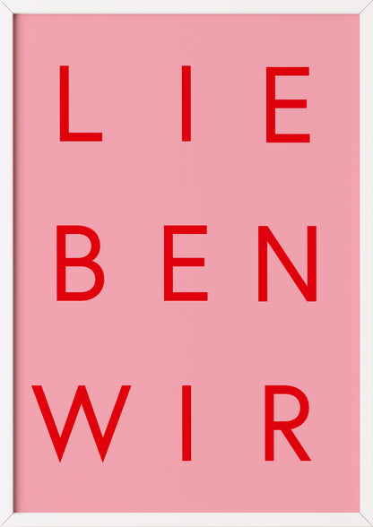 Rotes Typografieposter „LIEBEN WIR“ auf Rosa im weißen Holzrahmen