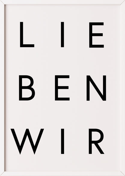 Schwarz-Weiß-Poster „LIEBEN WIR“ im weißen Holzrahmen